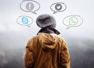Figure from behind with social media thought bubbles